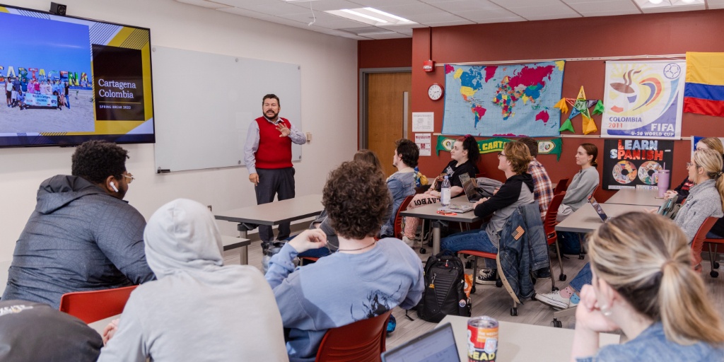 Professor speaking to students in class.
