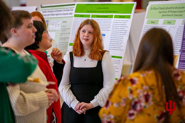 Students presenting at a research conference.