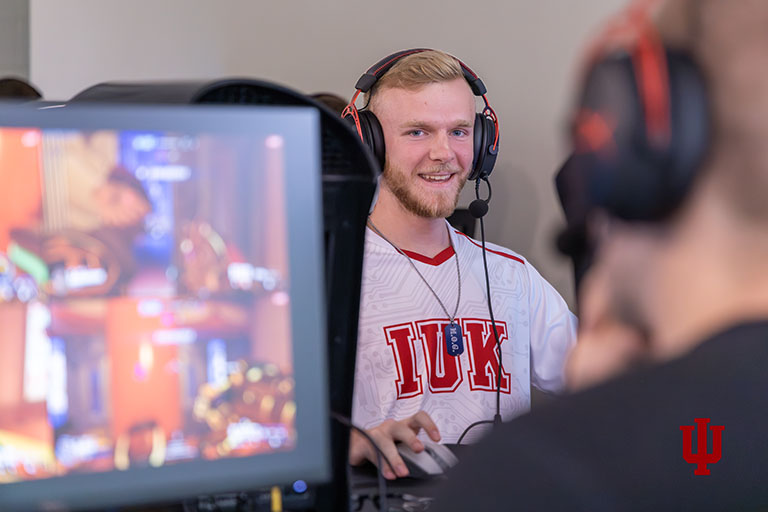 A student wearing a headset during an e-sports competition.