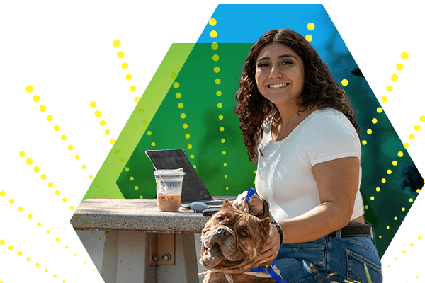 female student sitting with a coffee, her laptop and a dog with geometric shapes in the background.