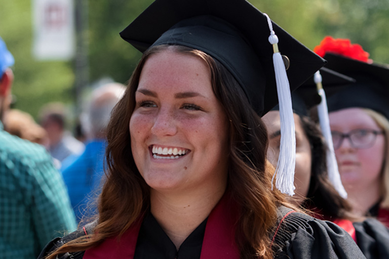 A joyful graduate at Commencement