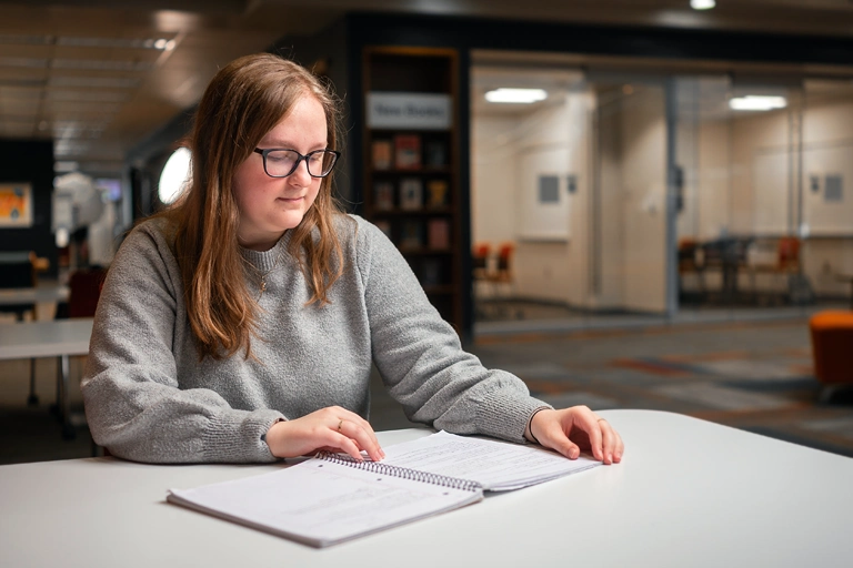 Student reading a book.