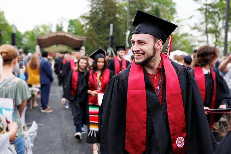 Student smiling at graduation.