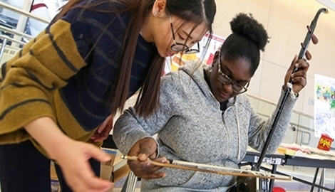 Students playing an instrument