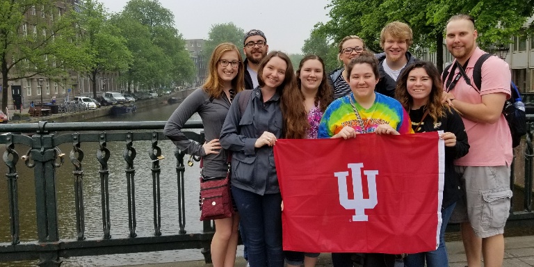 Students holding and IU banner.